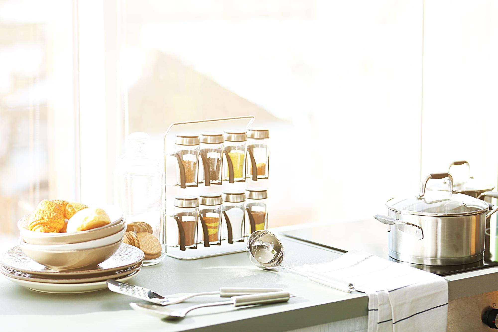 Open kitchen studio window with utensils